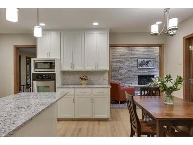 Cozy informal dining area abuts the kitchen, three