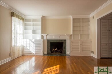 Living room with fireplace and built ins.