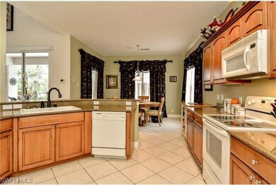 Kitchen with Wood Cabinets and Granite Counter Top