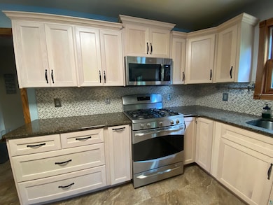 Kitchen with granite counters, stainless steel app