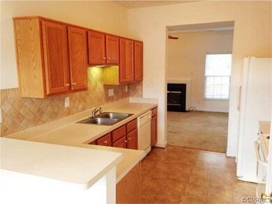 Kitchen with easy access to both Family Room and D