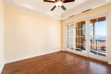 Unfurnished room featuring a tray ceiling, visible