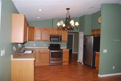 Spacious kitchen with stainless appliances.