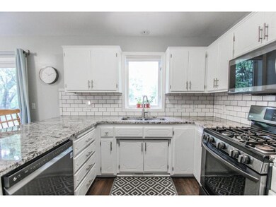Kitchen has abundant cabinet storage and ample cou