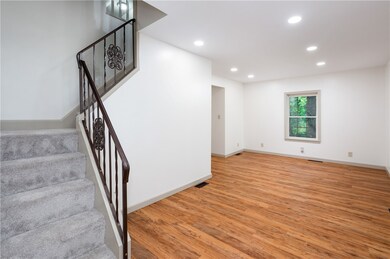 Living room with stairs to bedroom