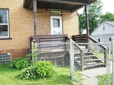 Exterior Back. Rear covered deck with door leading