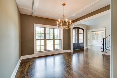 Formal dining with stunning coffered ceilings