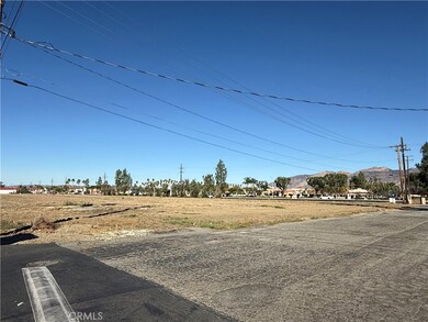 View from southeast corner of property looking northwest toward shopping center.