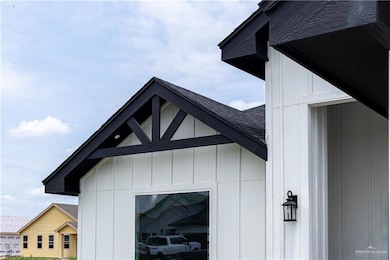 View of home's exterior with a shingled roof