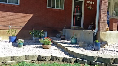 Entrance to property with brick siding