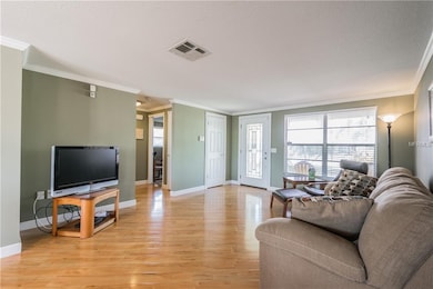 Living room area with gleaming wood laminate floor