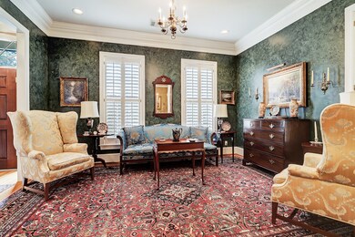 Just off the entry is a formal dining room. Crown