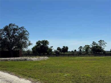 View of yard featuring a rural view and fence