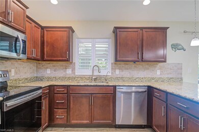 Kitchen with appliances with stainless steel finis