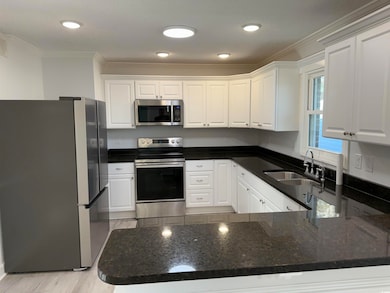 Kitchen with a sink, appliances with stainless ste