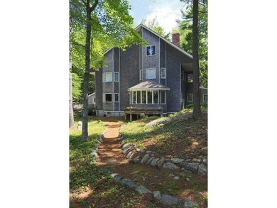 Exterior Front. From the pond side