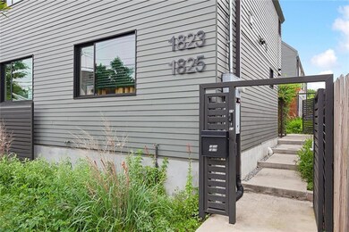 Entrance to the main house and the guest house. Front house with native plants and self-watering gutter grow system.