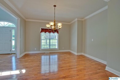A second look at the formal dining with it's hardwood floors and crown molding.
