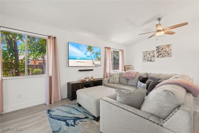 Living room with ceiling fan, light hardwood / woo