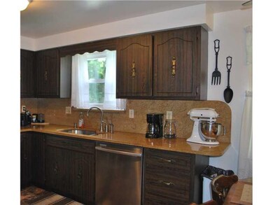 Kitchen. Kitchen has Stainless Dishwasher and Refr