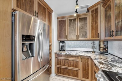 Kitchen featuring light stone countertops, rail li