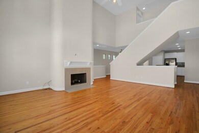 The living room connects to the kitchen and dining