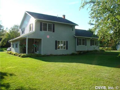 Exterior Back. Rear view. Neat & tidy landscaping.