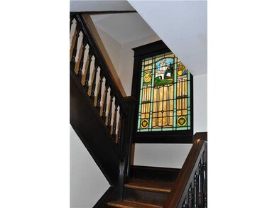 Entry/Foyer. Beautiful stained glass windows enhan