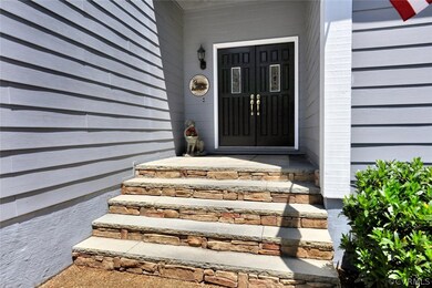 Covered front entrance has beautiful stone accents
