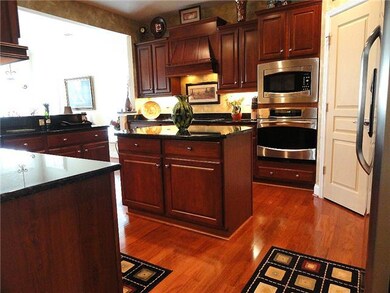 Spectacular Kitchen with granite countertops,  upgraded cherry cabinet with pullouts, and under cabinet lighting. 
