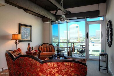 LIVING ROOM OPENS TO BALCONY