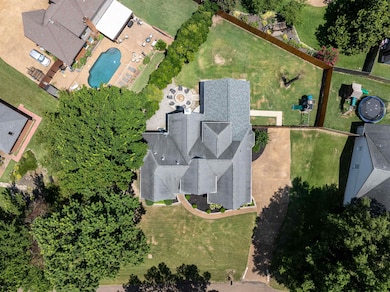Aerial view of property's location with a pool area