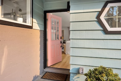 Adorable flamingo pink front door.