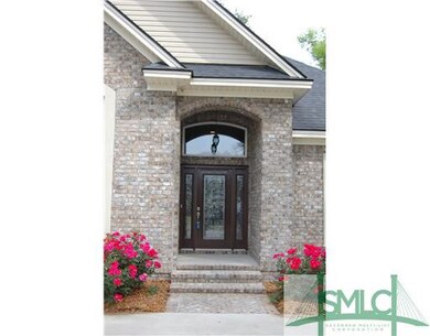 Exterior Front. Full brick, upgraded front door wi