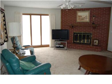 MAIN FLOOR FAMILY ROOM WITH BRICK FIREPLACE AND GR