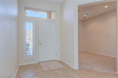 Foyer, partial view of den.  More photos of den, s