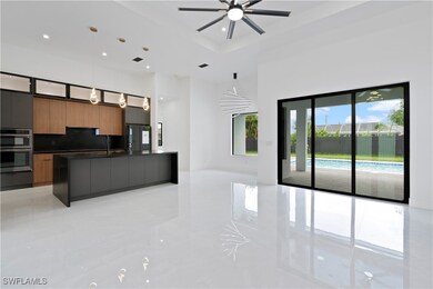 Kitchen with decorative light fixtures, a center i