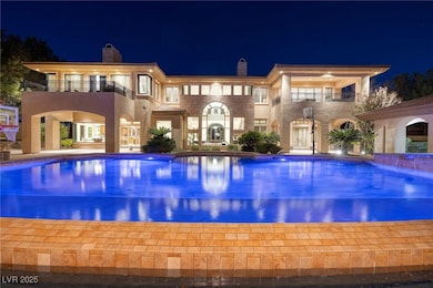 Pool at twilight featuring a patio area and an out