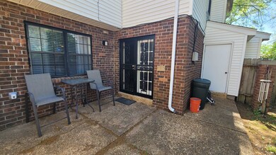 View of patio featuring fence