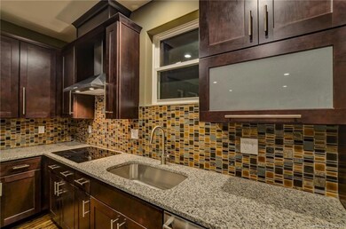 Close up of kitchen, granite countertops, upgraded appliance package