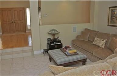 This family room features a gas fireplace with a b