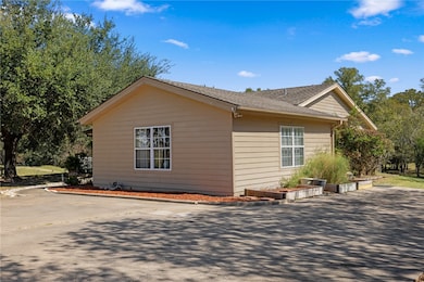 View of side of property with driveway