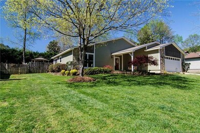 Plush front yard with view of gazebo in back.