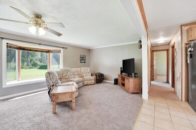 Living area leads to kitchen and 2 bedrooms and full bath,