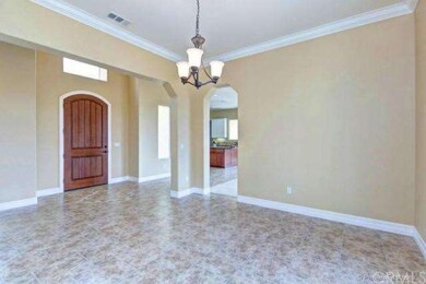 Entrance Hall to Dining Room with Crown Molding