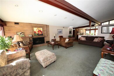 Great size living room with brick fireplace. Just 