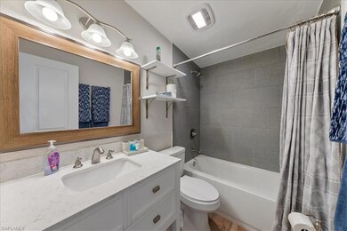 Full bathroom featuring visible vents, toilet, sho