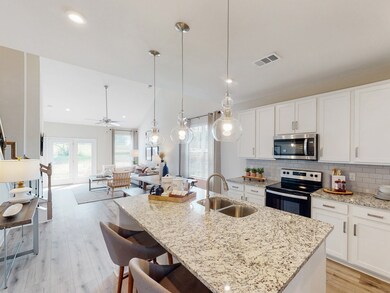 This is a photo of one of our model homes. Please know that some of the exterior and interior finishes, paint, and amenities may vary.