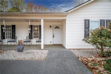 View of exterior entry featuring a porch