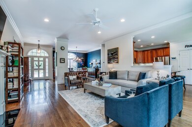 Large great room opens to kitchen and dining room.  The home has new windows with electronic and programmable shades.